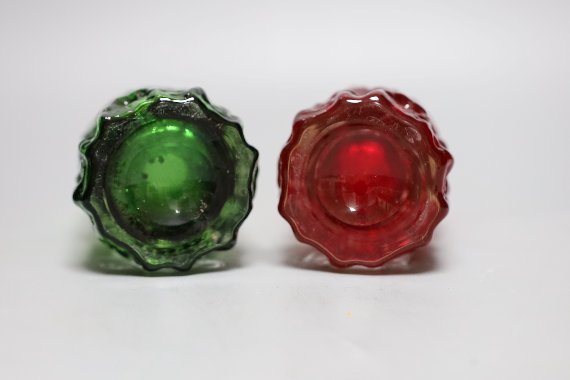 Two Whitefriars 'bark' cylinder vases, model 9689, designed by Geoffrey Baxter, in red and green glass, each 19cm high.